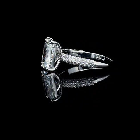 Emerald and pink pear engagement ring