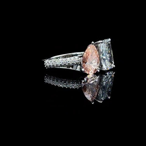 Emerald and pink pear engagement ring